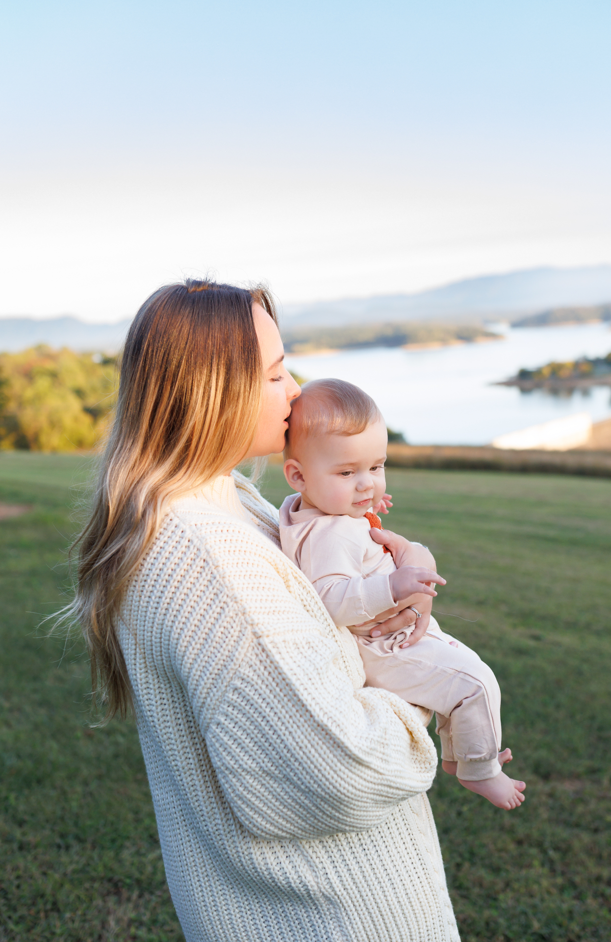 Anastasiia, Sevierville-based Smoky Mountains family photographer, with her son at golden hour